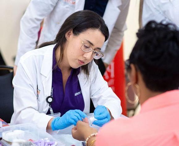 Pharmacy student attending to a patient